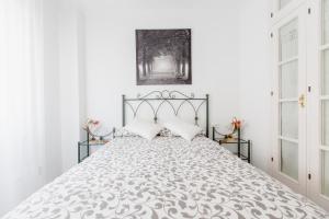 Posteľ alebo postele v izbe v ubytovaní Apartamentos Las Huertas