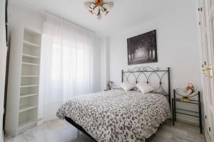 Posteľ alebo postele v izbe v ubytovaní Apartamentos Las Huertas