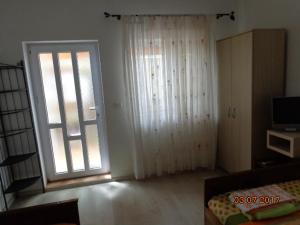Postel nebo postele na pokoji v ubytování Casa Munteanu