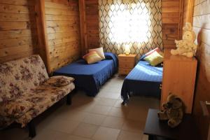 Postel nebo postele na pokoji v ubytování Camping & Bungalows Oasis