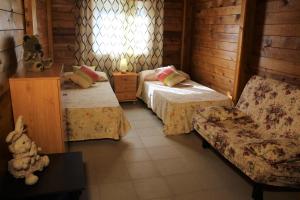 Postel nebo postele na pokoji v ubytování Camping & Bungalows Oasis