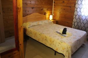 Postel nebo postele na pokoji v ubytování Camping & Bungalows Oasis