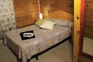 Postel nebo postele na pokoji v ubytování Camping & Bungalows Oasis