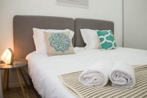 Postelja oz. postelje v sobi nastanitve Camões 691 Design Apartments by Porto City Hosts