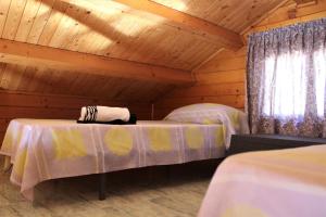 Postel nebo postele na pokoji v ubytování Camping & Bungalows Oasis
