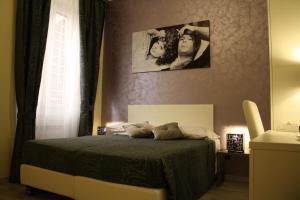 A bed or beds in a room at Residenza Elizabeth