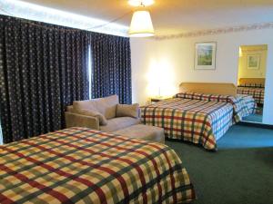 Postel nebo postele na pokoji v ubytování Townhouse Motel