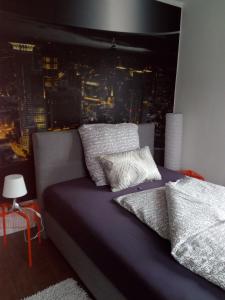 a bedroom with a bed with a view of a city at Landhotel Alte Mühle in Modautal