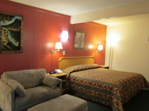 Postel nebo postele na pokoji v ubytování Townhouse Motel