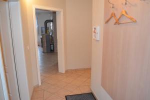 a hallway with hangers on the wall and a hallway with a hallway at FH Bernstein in Ostseebad Karlshagen