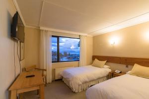 TV a/nebo společenská místnost v ubytování Hotel Saltos del Paine