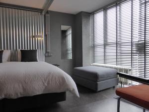 Een bed of bedden in een kamer bij Plano5 - Robust Design
