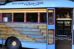 a food truck with signs on the side of it at Big Sur River Inn in Big Sur