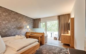 Postel nebo postele na pokoji v ubytování Hotel Villa Hügel