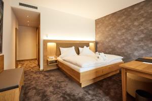 Postel nebo postele na pokoji v ubytování Hotel Villa Hügel