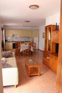 a living room with a couch and a table at Casa Armando in Caleta de Sebo