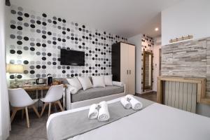 Postel nebo postele na pokoji v ubytování Vatican Treasure