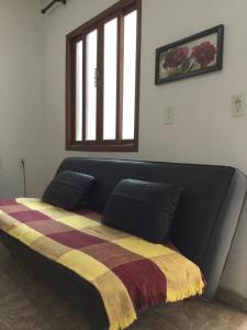 A bed or beds in a room at Venha para Florianópolis