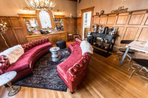 a living room with a couch and a table at Ember Hostel in Denver