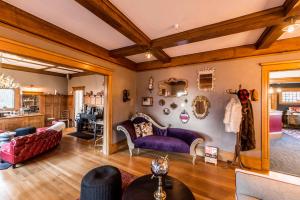 a living room with a couch and chairs at Ember Hostel in Denver