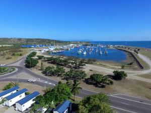 a large body of water with several boats in it at Harbour Lights Tourist Park in Bowen