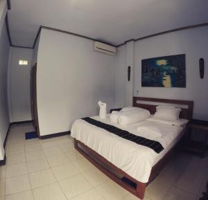 Tempat tidur dalam kamar di Danke Lodge