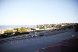 an aerial view of a street with a car on the road at view at the bay 4 in Mossel Bay