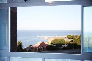 a window with a view of the ocean at view at the bay 4 in Mossel Bay