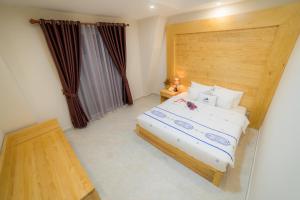 Postel nebo postele na pokoji v ubytování Starhill Hotel