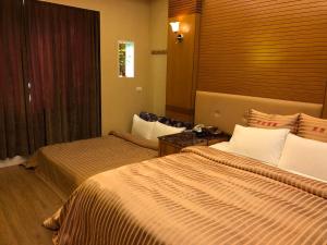 Postel nebo postele na pokoji v ubytování Lai Yin Motel