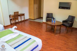 TV a/nebo společenská místnost v ubytování Eastmark Hotel