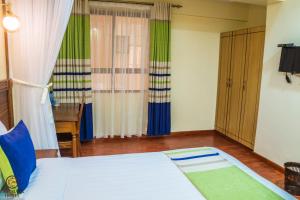 Postel nebo postele na pokoji v ubytování Eastmark Hotel