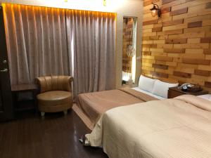 Postel nebo postele na pokoji v ubytování Lai Yin Motel