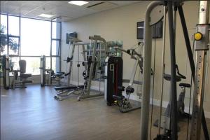 a gym with a bunch of exercise equipment in a room at 615 Sandton Skye in Johannesburg