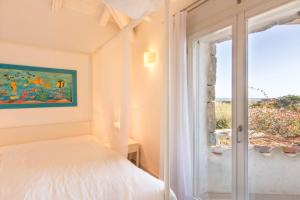 Ένα ή περισσότερα κρεβάτια σε δωμάτιο στο Villa Ginestra con piscina e giardino privato a 500 mt dal mare +32 φωτογραφίες