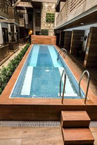 a large swimming pool in a building at The Piccolo Hotel of Boracay in Boracay