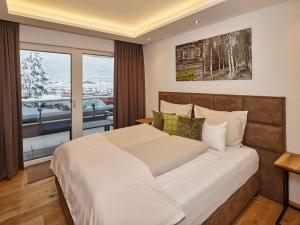 Tempat tidur dalam kamar di A-VITA Viktoria & A-VITA living luxury apartments