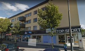 a building with a top rent sign in front of it at Studiohuoneisto Lohjan keskusta in Lohja