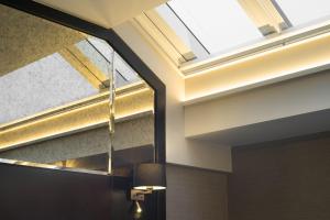 a skylight in the ceiling of a room at Camden Enterprise Hotel in London +85 photos