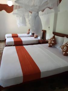 Letto o letti in una camera di Sigiri Heritage Villa