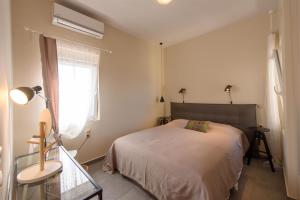 Posteľ alebo postele v izbe v ubytovaní Rodia Beach Suites