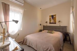 Posteľ alebo postele v izbe v ubytovaní Rodia Beach Suites