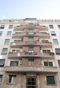 a tall white building with windows at Suite GG in Vatican in Rome