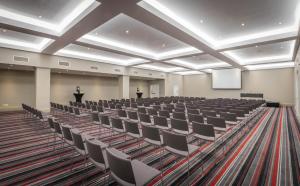 an empty lecture hall with chairs and a podium at Riu Plaza The Gresham Dublin in Dublin