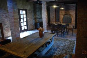 a large room with a wooden table and a dining room at Pension Holetín in Horní Holetín