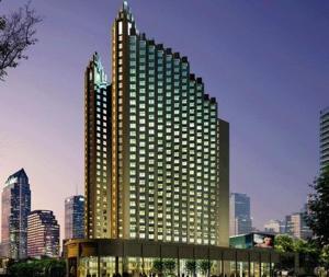 a large building with many windows in a city at Ziyuan Service Apartment in Shanghai