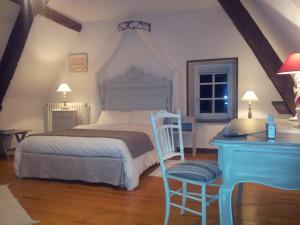 Ένα ή περισσότερα κρεβάτια σε δωμάτιο στο La Maison du Prince de Condé