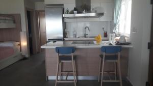 Kuchyňa alebo kuchynka v ubytovaní Rodia Beach Suites