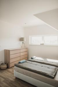 Postel nebo postele na pokoji v ubytování Apartmán Dunajky