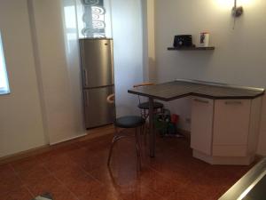a kitchen with a counter and a refrigerator at Lunitz 19 in Görlitz
